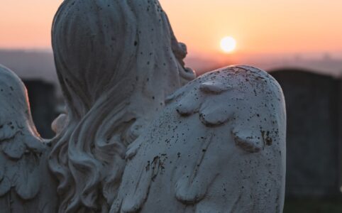 angelic statue and sunset scenery